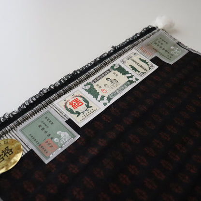 本場結城紬 | 着尺 | 正絹 | 大正絣 墨黒緋紋 | 黒赤 | 小倉商店